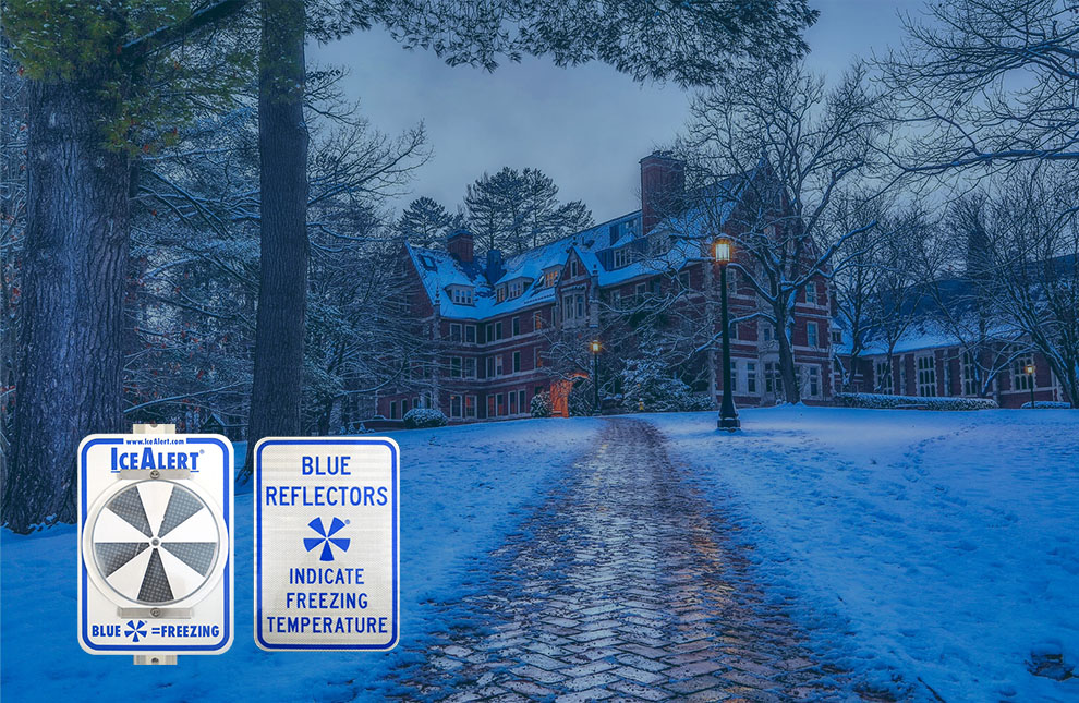 Icy pathway with IceAlert reflector and informational sign in foreground