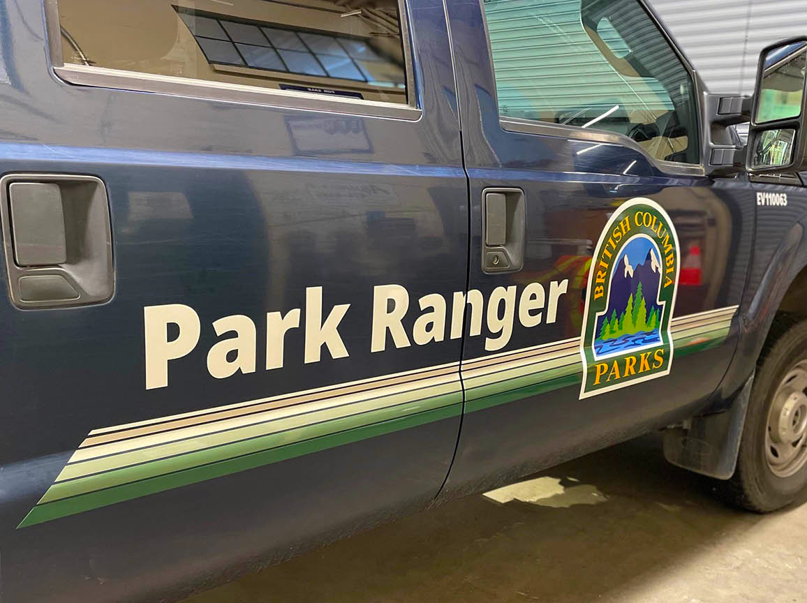 Vinyl vehicle decal on the side of a blue truck